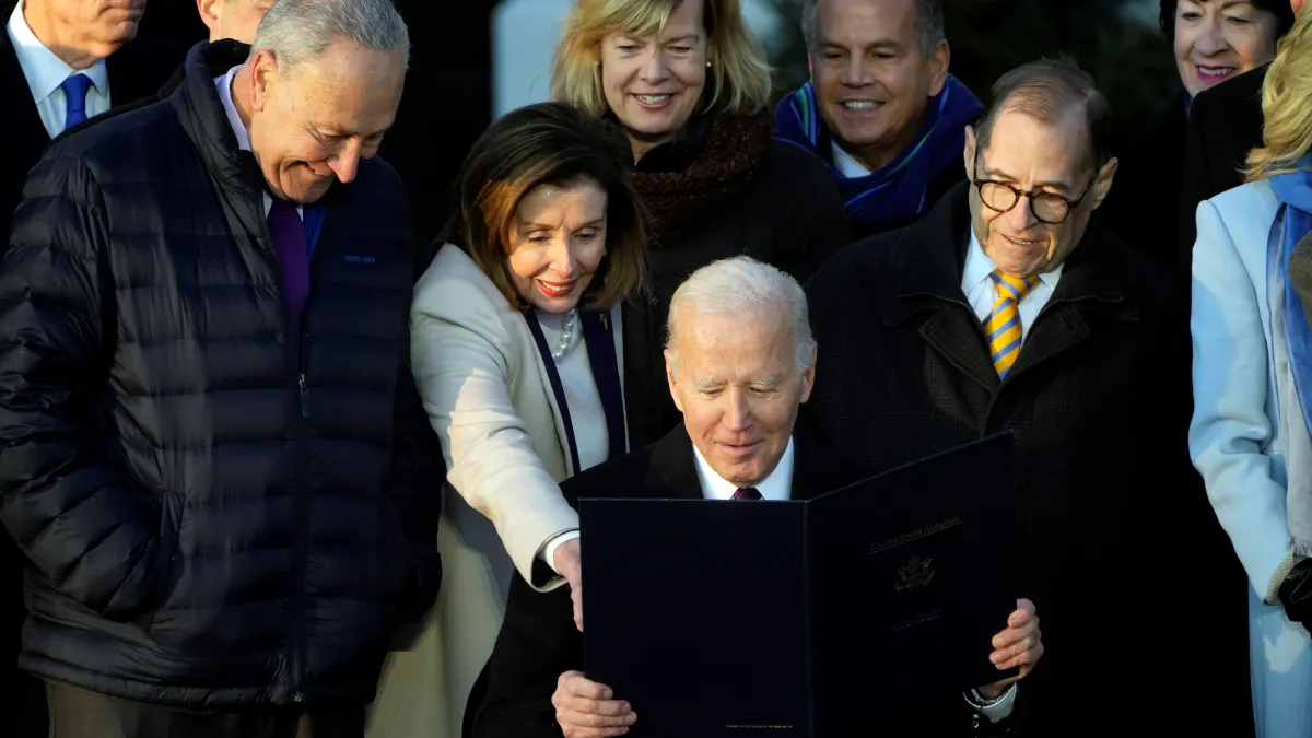 Biden and lawmakers at the Respect for Marriage Act signing.