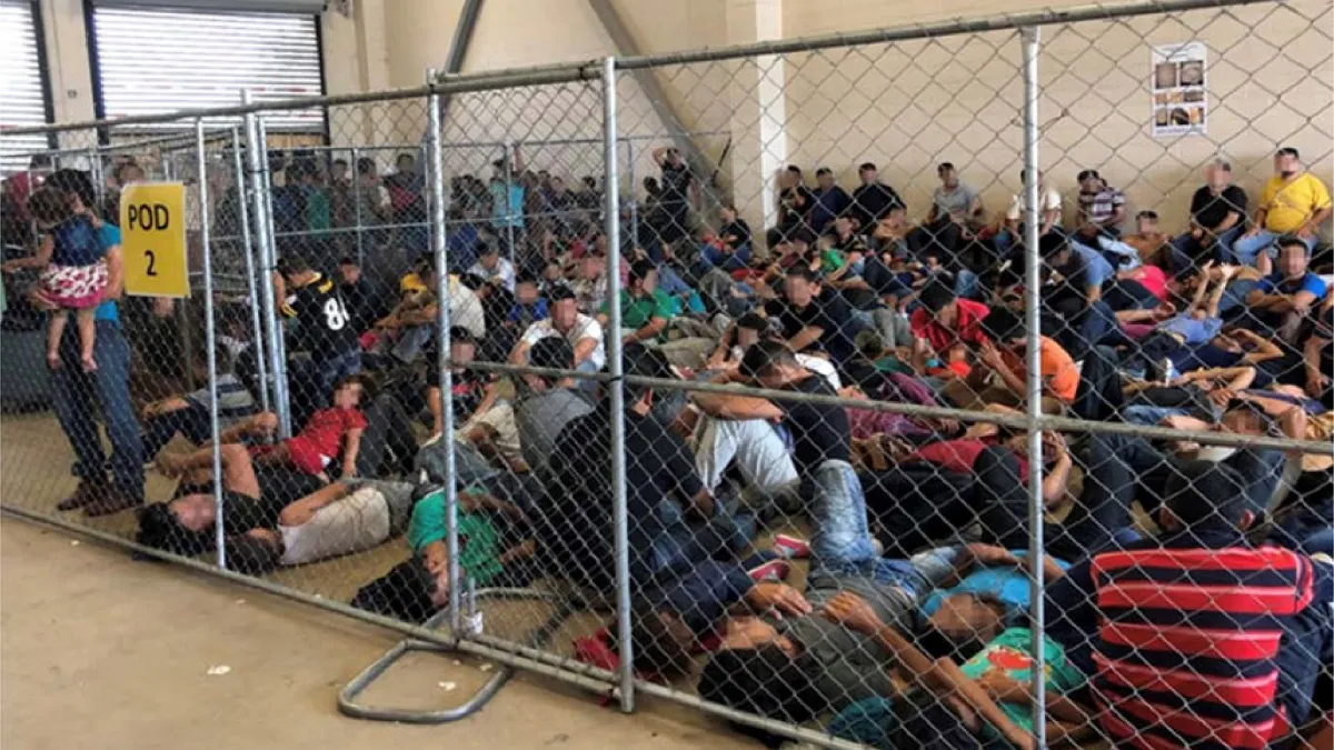 An overcrowded fenced area holding families at a Border Patrol station is seen in McAllen