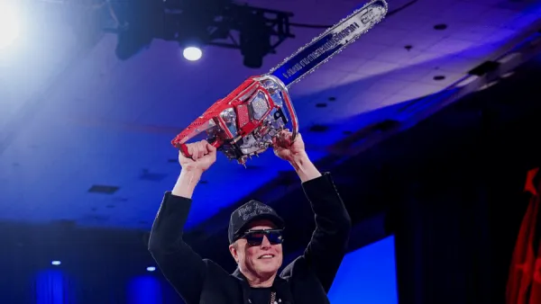 Elon Musk holds a chainsaw at the Conservative Political Action Conference Thursday (Reuters)
