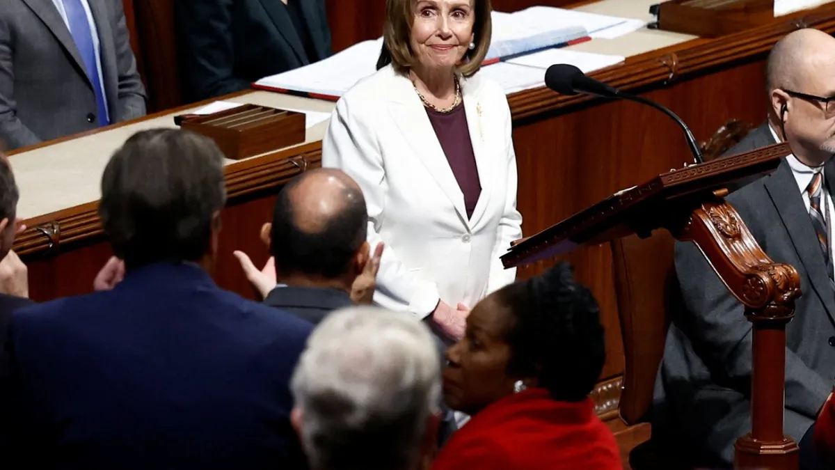 Pelosi takes in the applause from her colleagues. Pelosi takes in the applause from her colleagues.