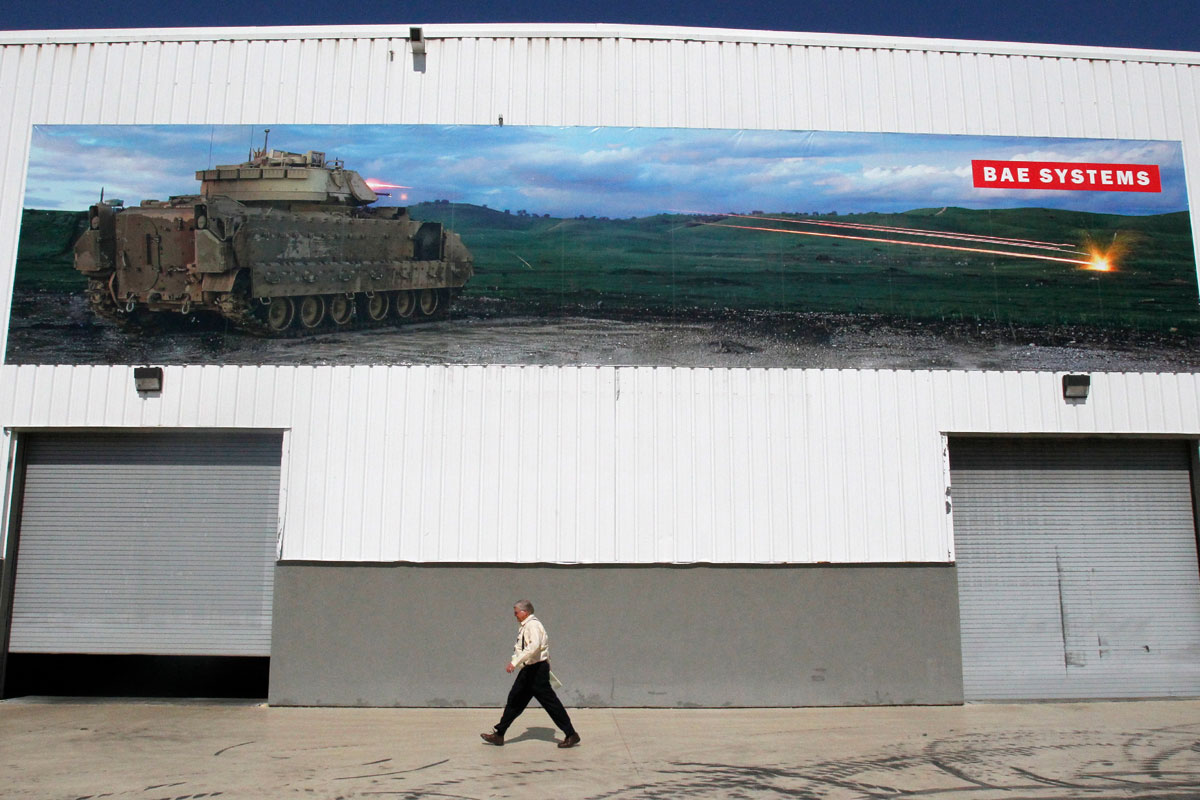 A worker uses a crane to lift a Bradley fighting vehicle on the BAE systems Bradley fighting vehicle  at the BAE systems York Facility in York, Pennsylvania