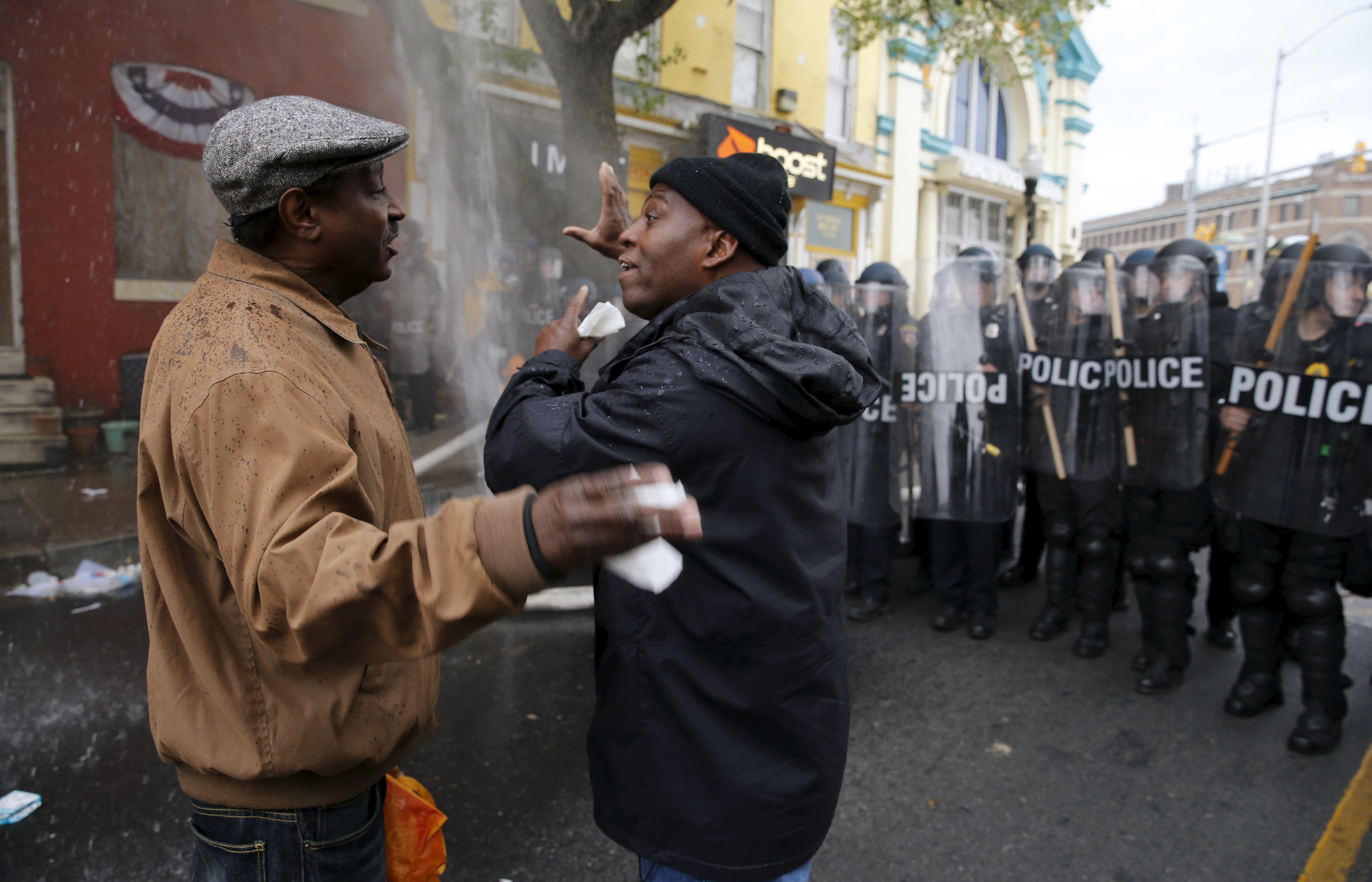 A Baltimore resident trying to restore order in his neighborhood speaks to a protester during clashes in Baltimore