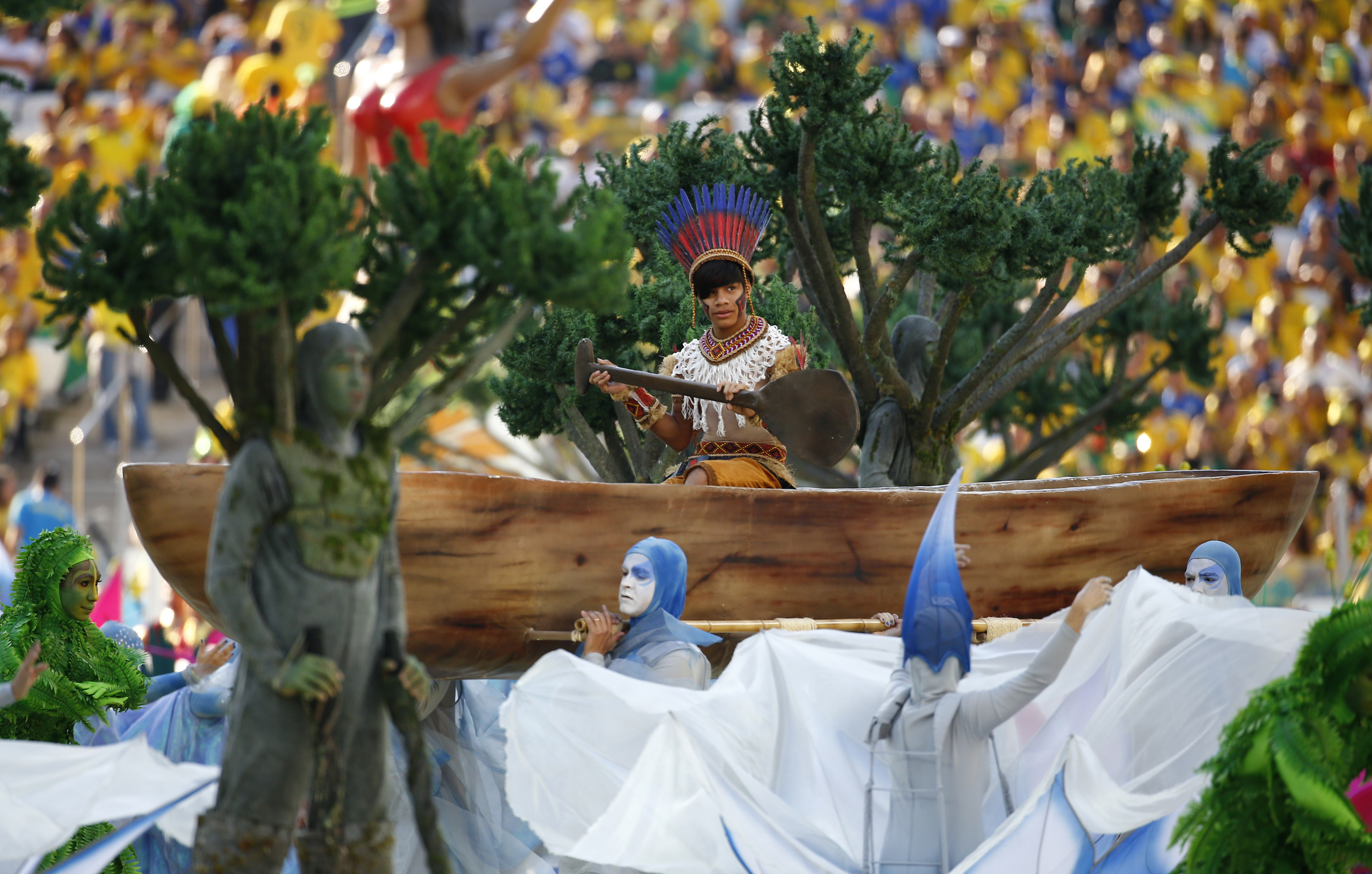 Performers participate in the opening ceremony of the 2014 World Cup at the Corinthians arena in Sao Paulo