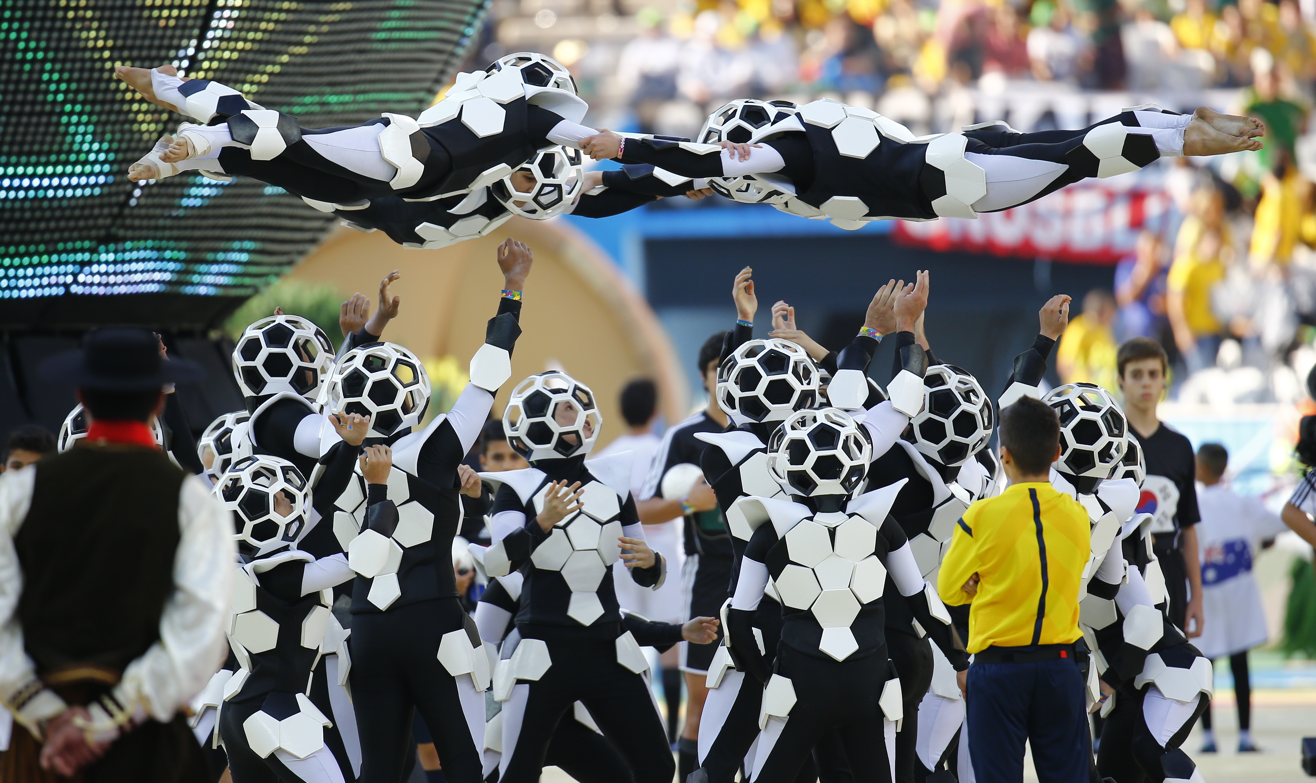 Performers dance during the opening ceremony of the 2014 World Cup at the Corinthians arena in Sao Paulo 