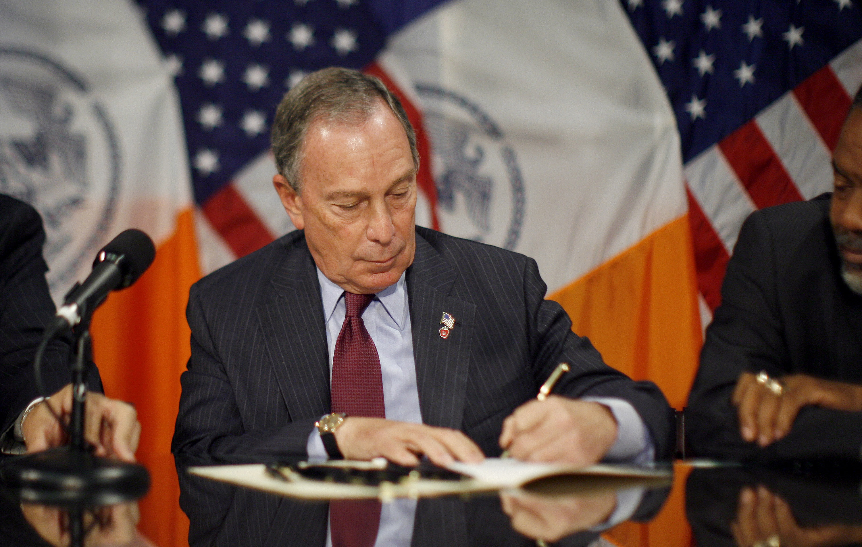 Mayor of New York, Michael Bloomberg, signs a bill extending term limits on elected officials at City Hall in New York