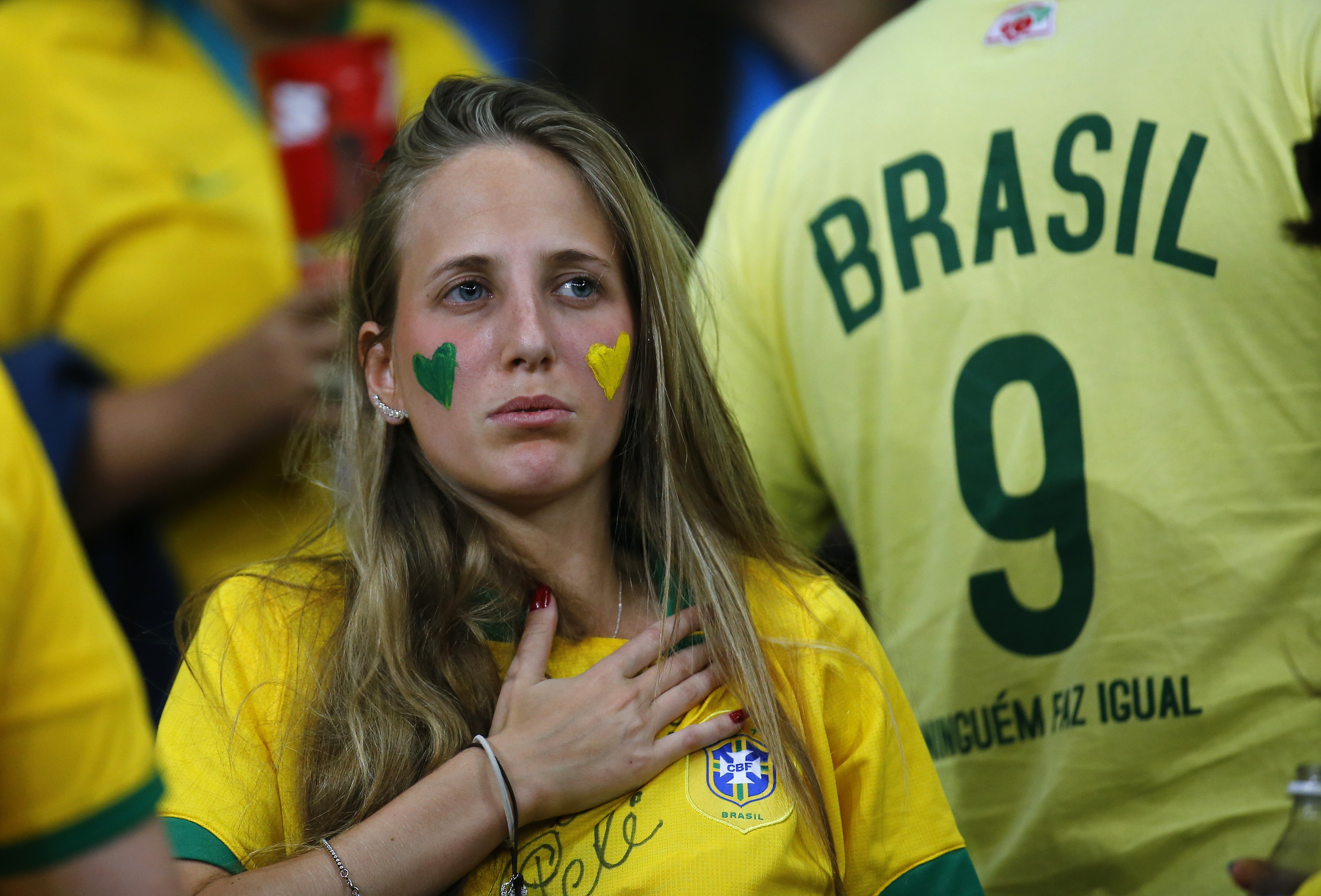 A Brazil fan reacts during the team's 2014 World Cup semi-finals against Germany at the Mineirao stadium in Belo Horizonte