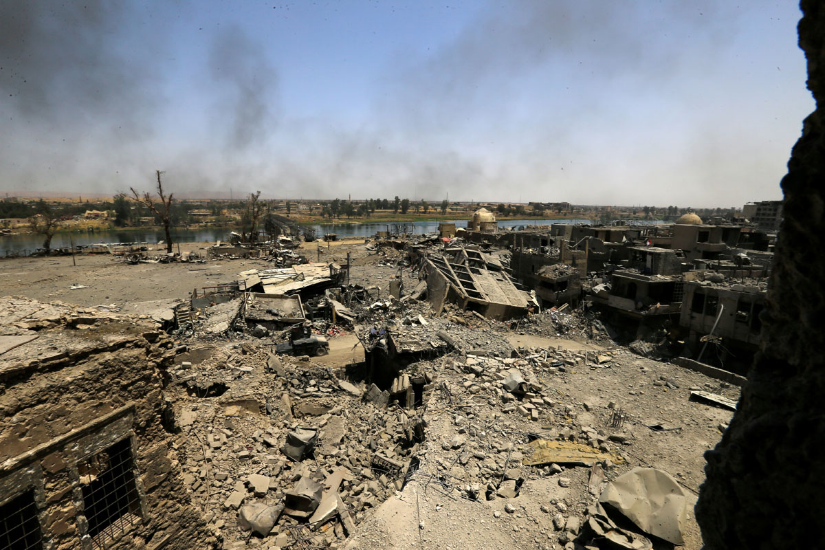 An old bridge destroyed by clashes is seen in the Old City of Mosul