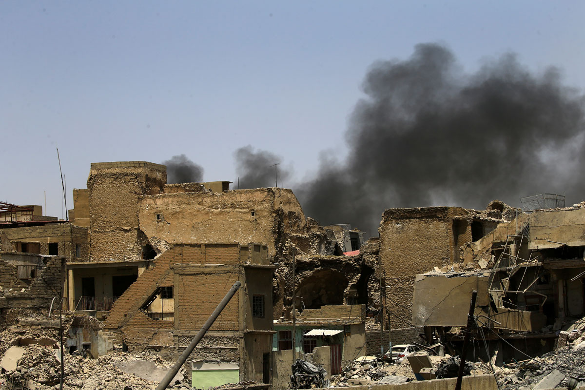 Smoke rises from clashes in the Old City of Mosul