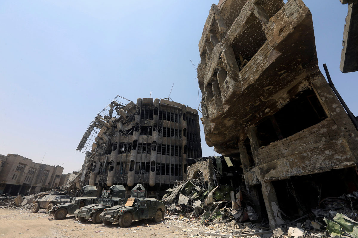 Military vehicles of Iraqi security forces are seen in the Old City of Mosul