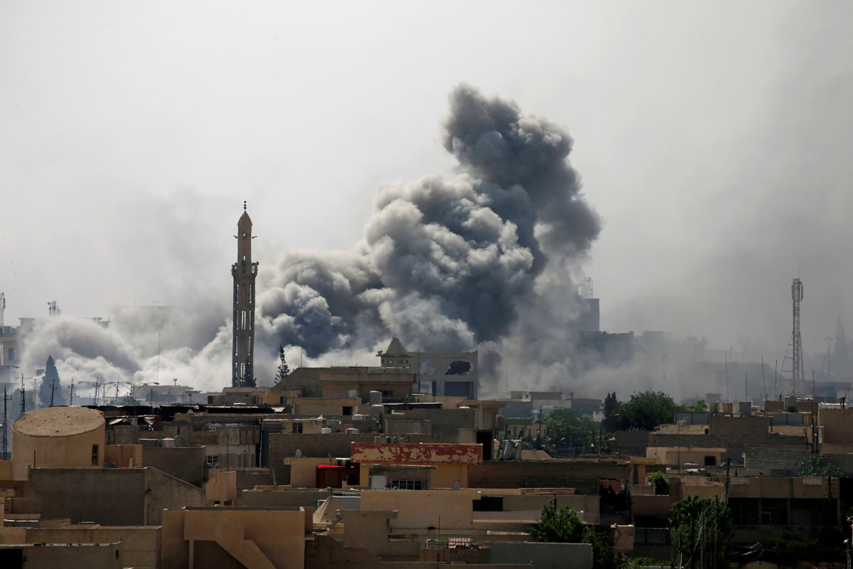 Smoke rises from an airstrike during a battle between Iraqi forces and Islamic State militants in western Mosul