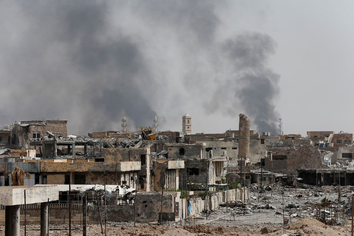 Smoke rises from clashes during the fight with the Islamic States militants in the Old City of Mosul