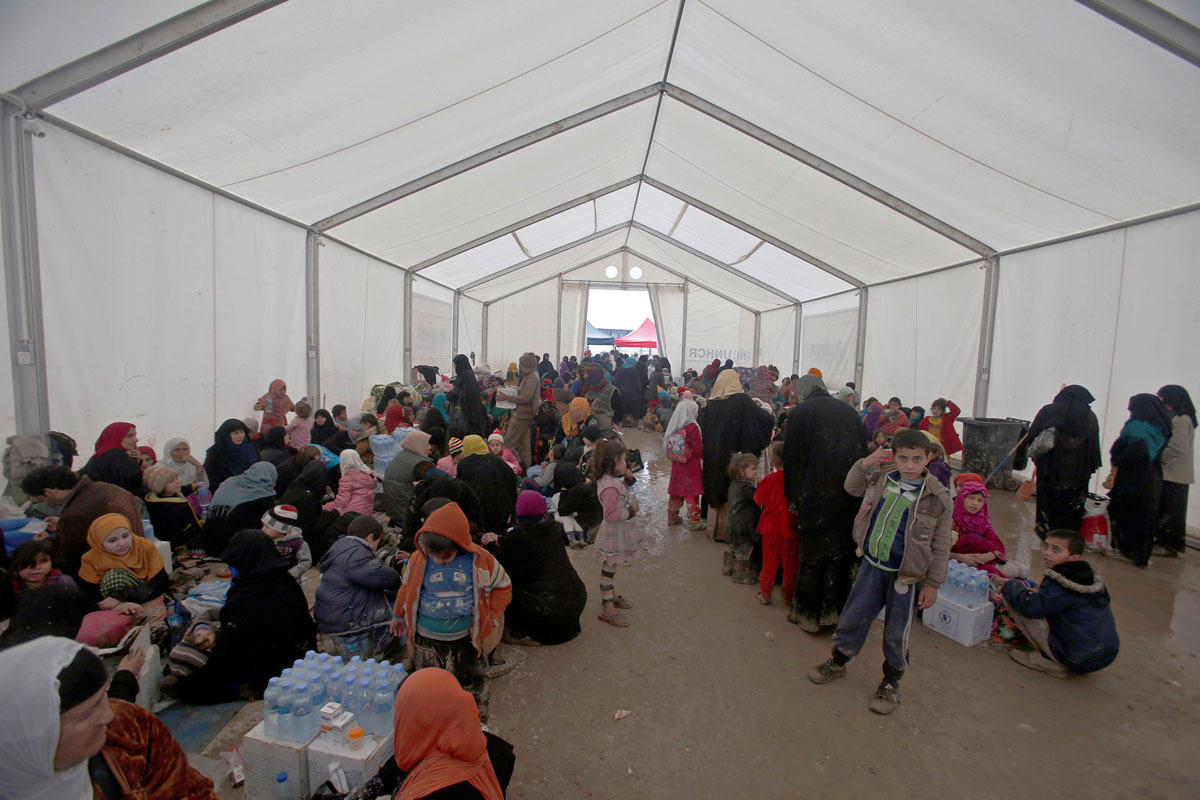 Displaced Iraqi people gather at Hammam al-Alil camp, Iraq