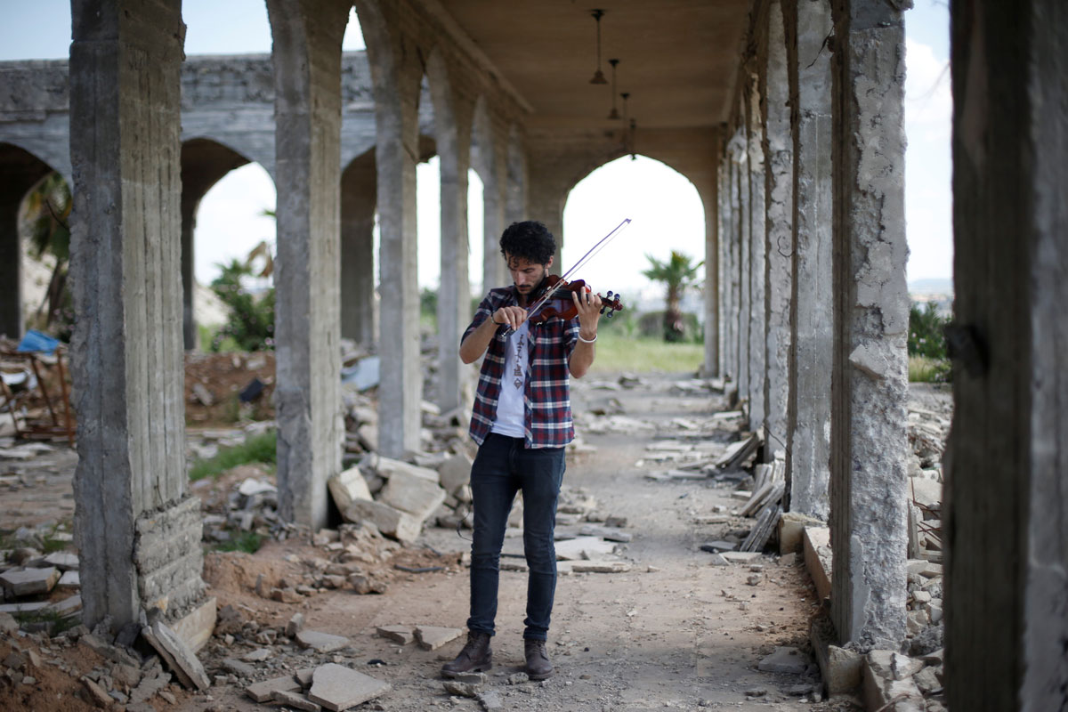 Ameen Mukdad, a violinist from Mosul who lived under ISIS's rule for two and a half years where they destroyed his musical instruments, performs in eastern Mosul