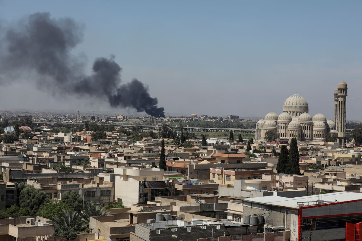 A smoke rises as Iraqi forces fight Islamic State militants in Mosul