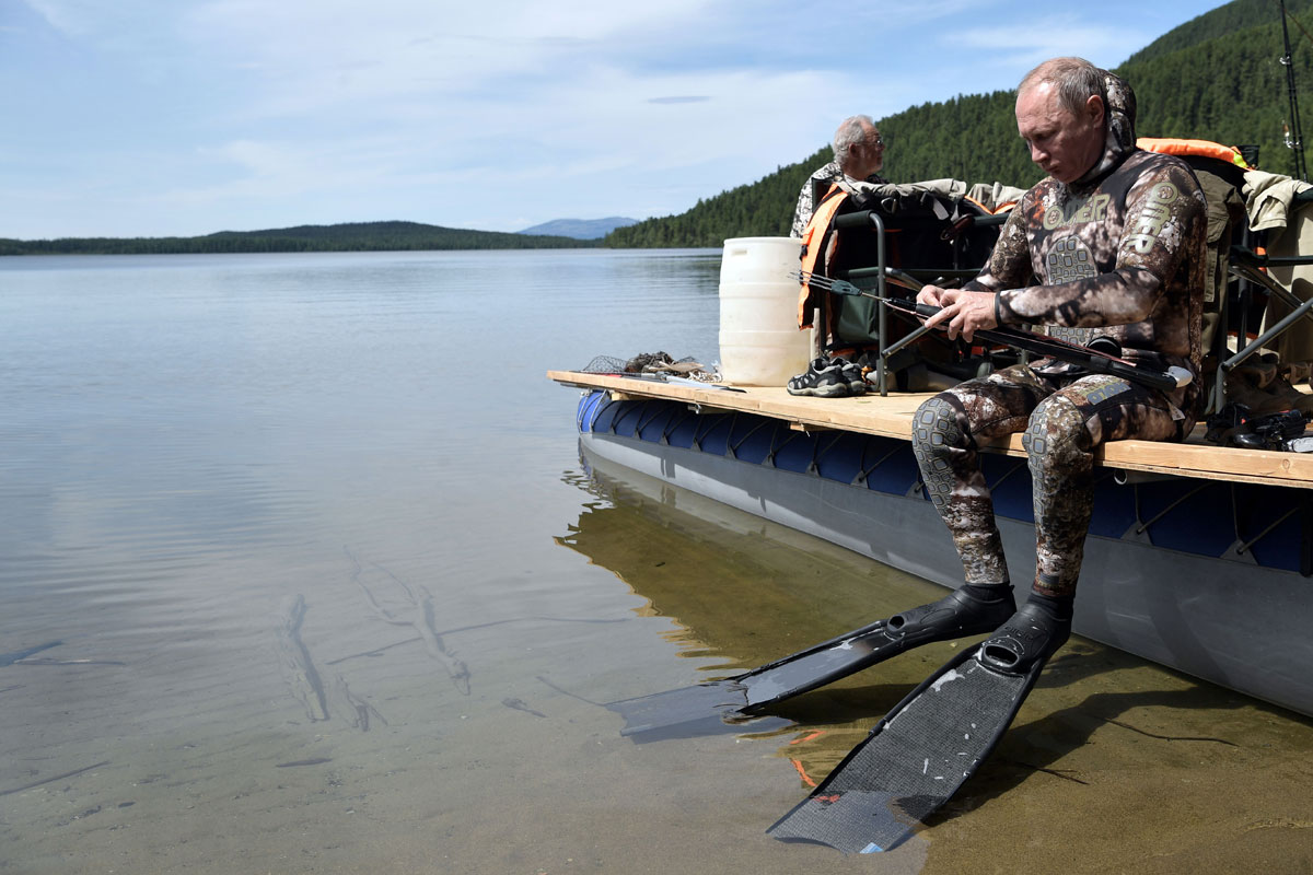 Russian President Vladimir Putin prepares for snorkeling during the hunting and fishing trip which took place on August 1-3 in the republic of Tyva in southern Siberia