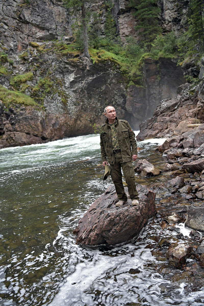 Russian President Vladimir Putin poses for a photo during the hunting and fishing trip which took place on August 1-3 in the republic of Tyva in southern Siberia