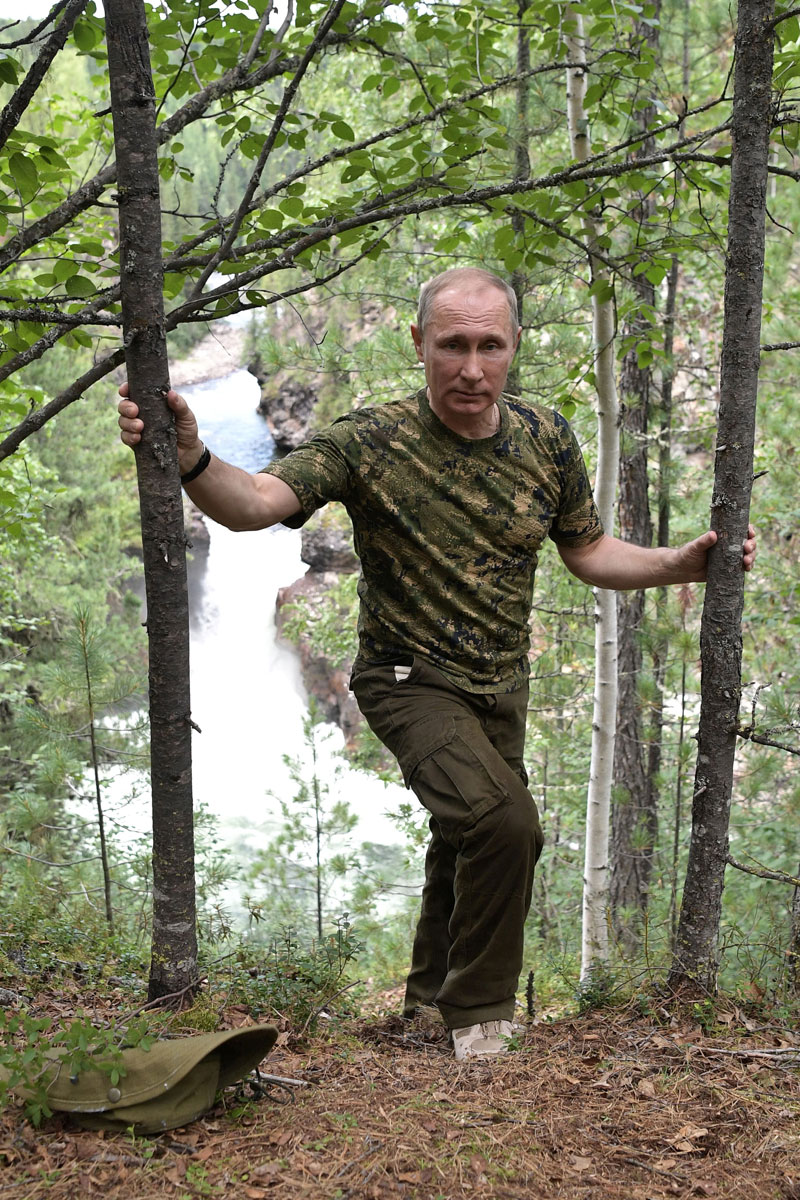 Russian President Vladimir Putin poses for a photo during the hunting and fishing trip which took place on August 1-3 in the republic of Tyva in southern Siberia