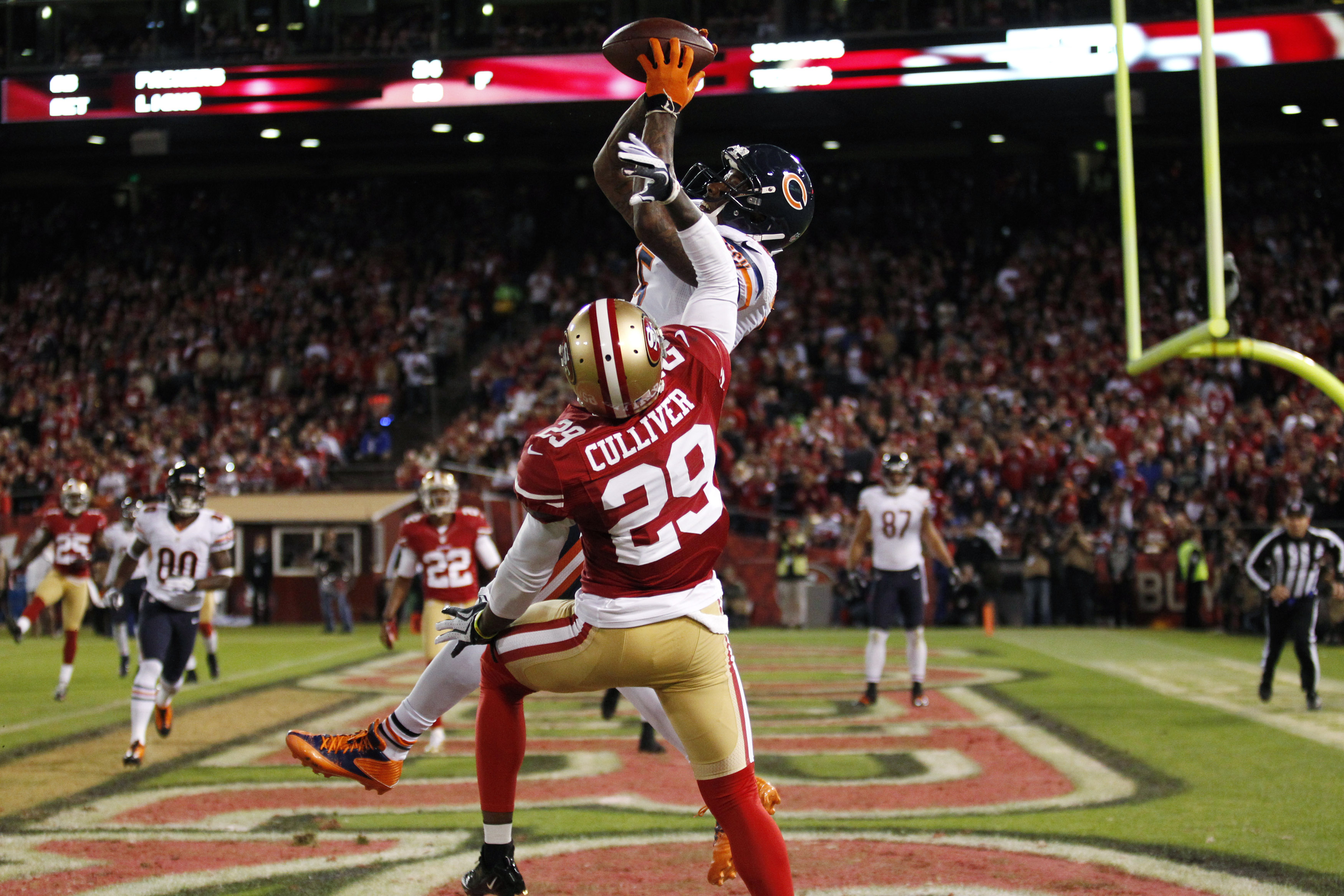 Chicago Bears' Marshall catches a touchdown pass above San Francisco 49ers' Culliver during their NFL football game in San Francisco