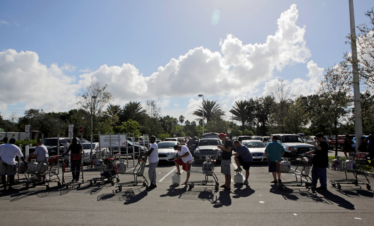 People line up to fill their LP propane gas cylinders in anticipation of Hurricane Matthew, in Coral Springs