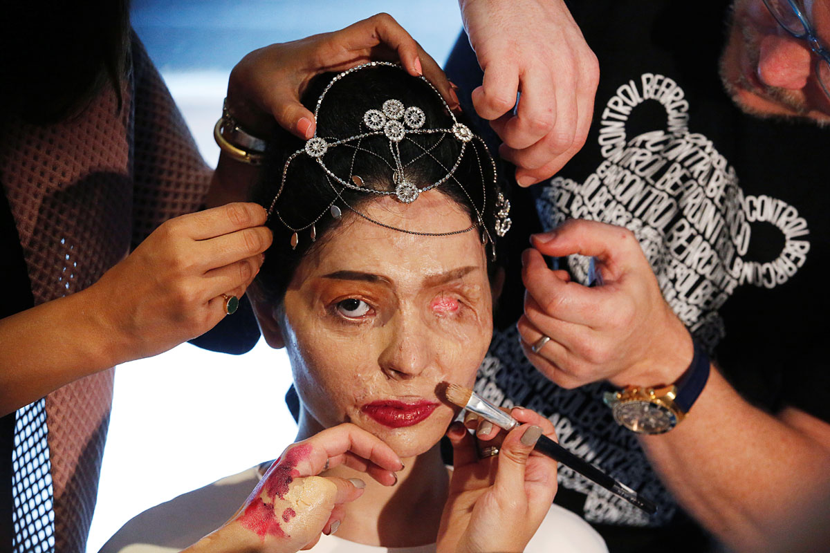 Indian model and acid attack survivor Reshma Quereshi has make up applied before walking to present Indian designer Archana Kochhar's Spring/Summer 2017 collections during New York Fashion Week in the Manhattan borough of New York