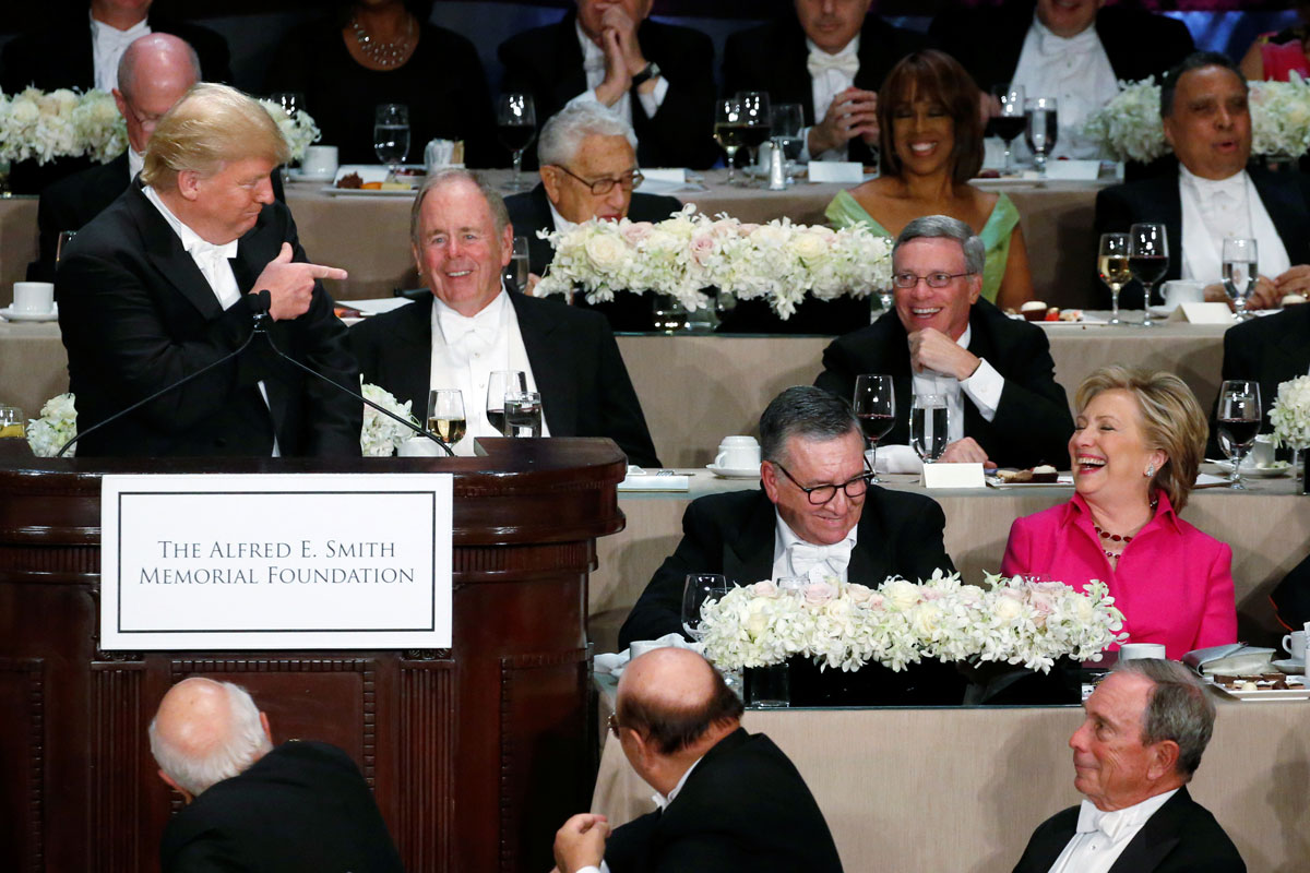 Democratic U.S. presidential nominee Clinton reacts to a joke by Republican U.S. presidential nominee Trump at the Alfred E. Smith Memorial Foundation dinner in New York