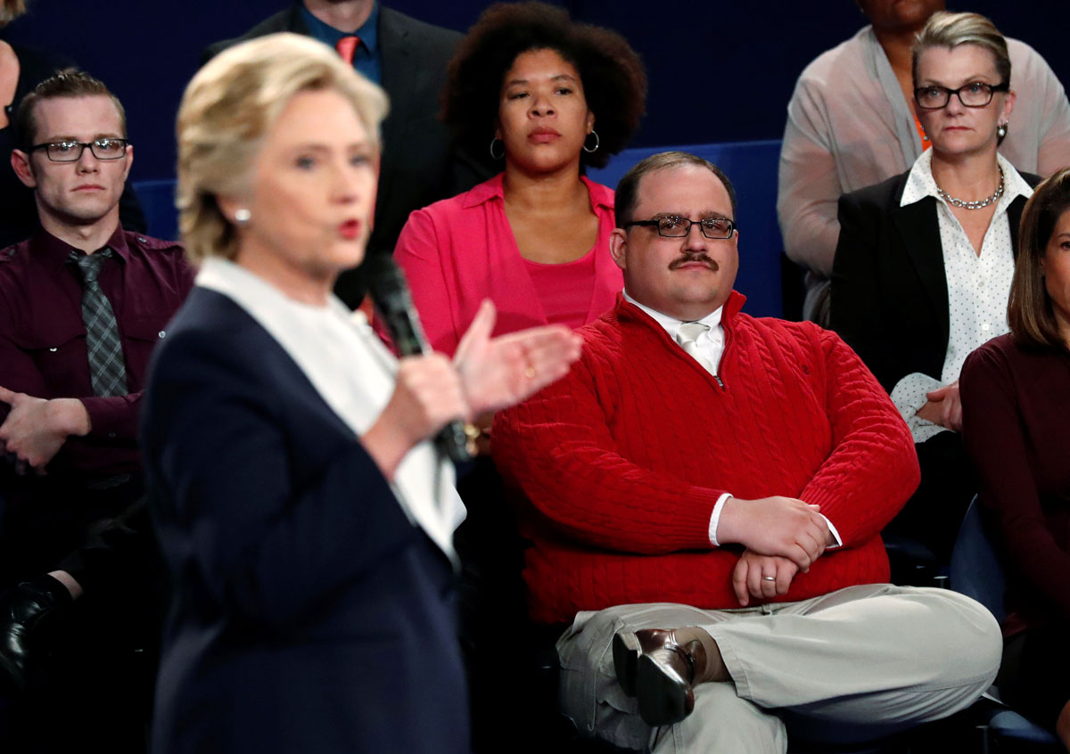 Ken Bone listens to Democratic presidential nominee Clinton debate Republican nominee Trump during their presidential debate in St. Louis