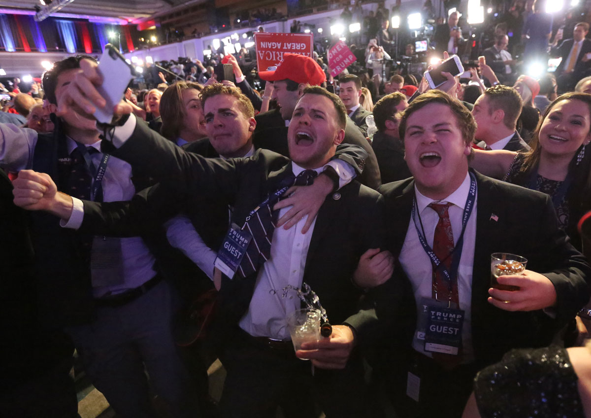 Supporters of U.S. Republican presidential nominee Donald Trump react at his election night rally in Manhattan