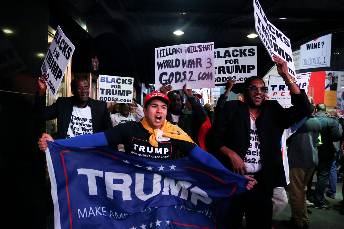 Supporters of U.S. President-elect Donald Trump rally through Times Square, New York