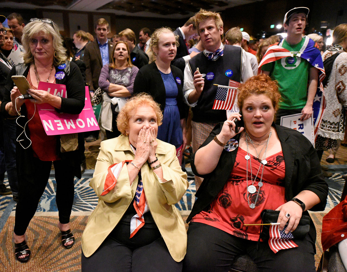 Thrashers react to a stream of news at Republican Governor Pat McCrory's election-night party in Raleigh