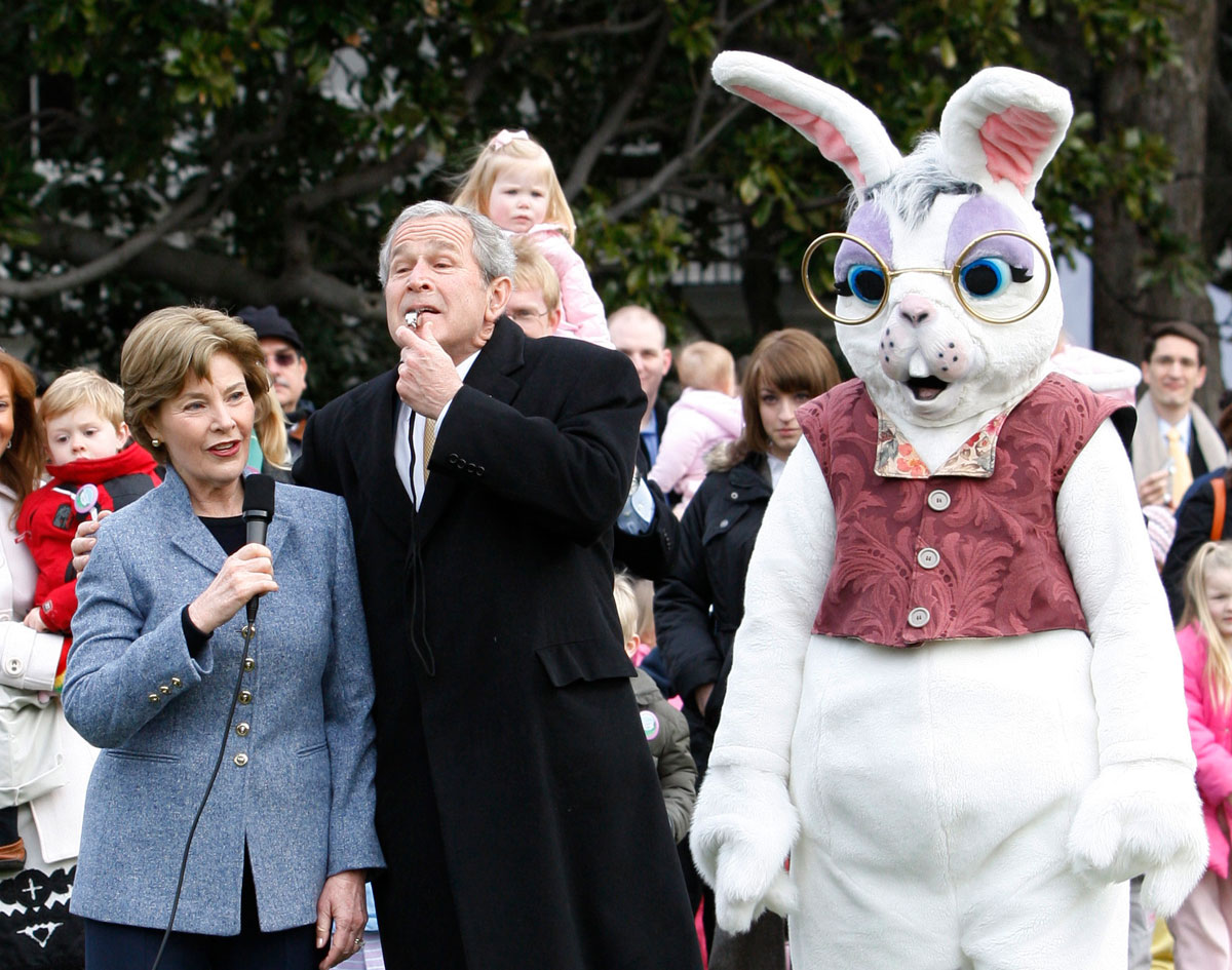U.S. President Bush blows a whistle to start the annual Easter Egg Roll in Washington