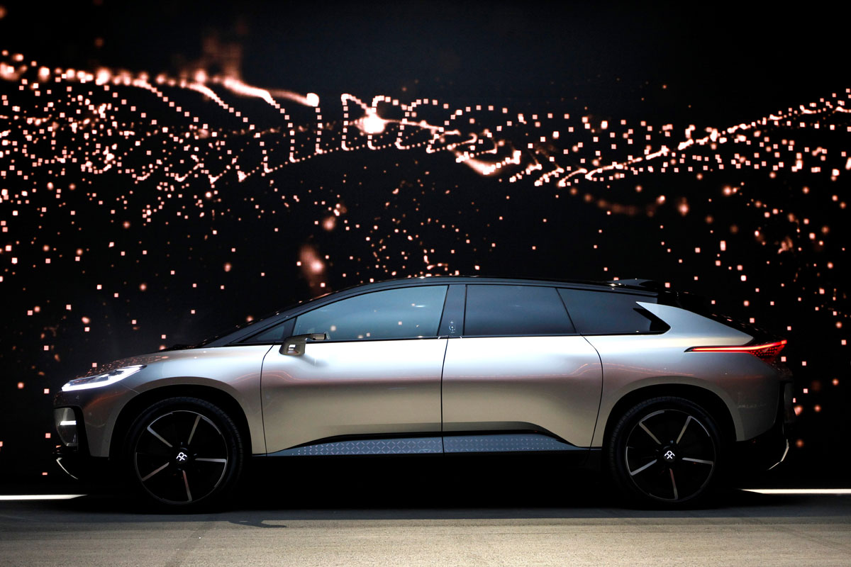 A Faraday Future FF 91 electric car is displayed on stage during an unveiling event at CES in Las Vegas