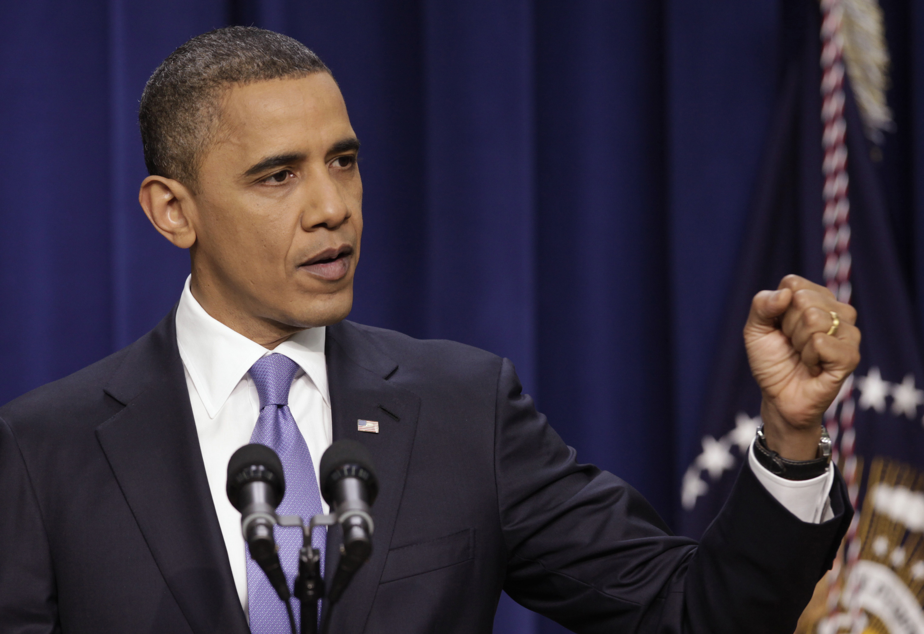 U.S. President Barack Obama gestures during his news conference at the White House