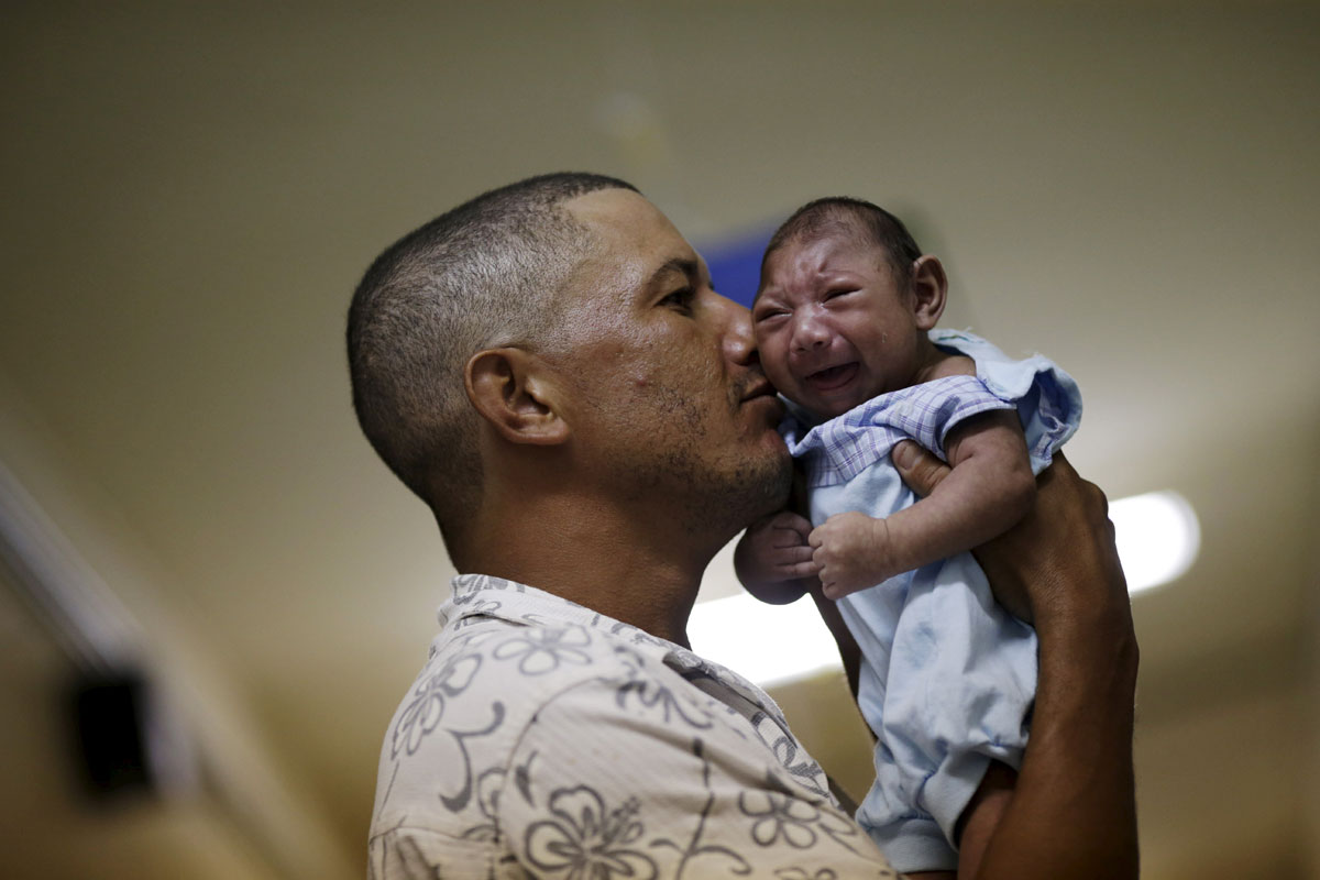 Geovane Silva holds his son Gustavo Henrique, who has microcephaly, at the Oswaldo Cruz Hospital in Recife, Brazil