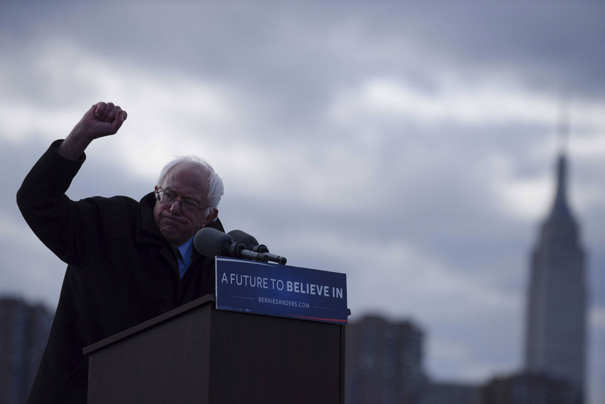 The Empire State Building is seen in the background as Senator Bernie Sanders gestures during a campaign rally in the Brooklyn New York 