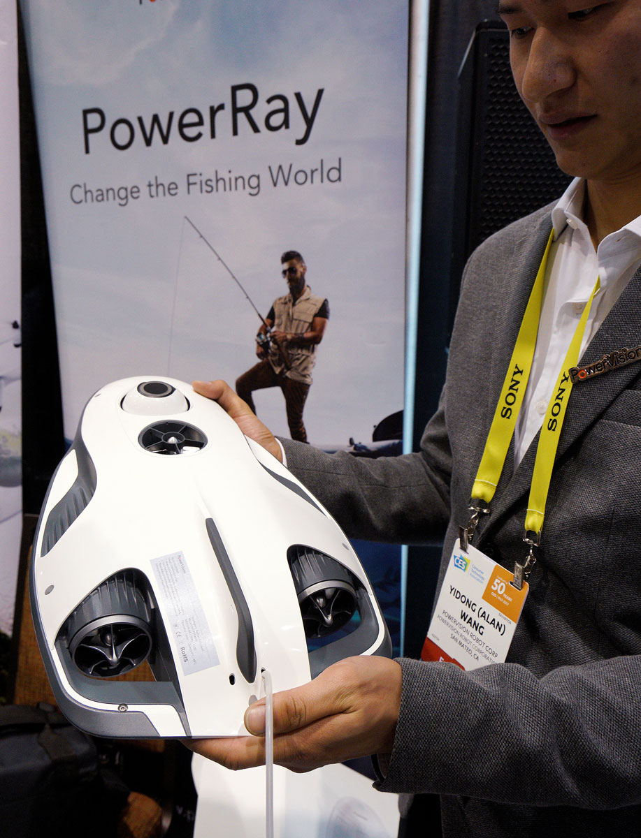 Alan Wang, technical support engineer with Powervision Robot Corp., shows off the PowerRay fish-finder equipped fishing drone at CES in Las Vegas