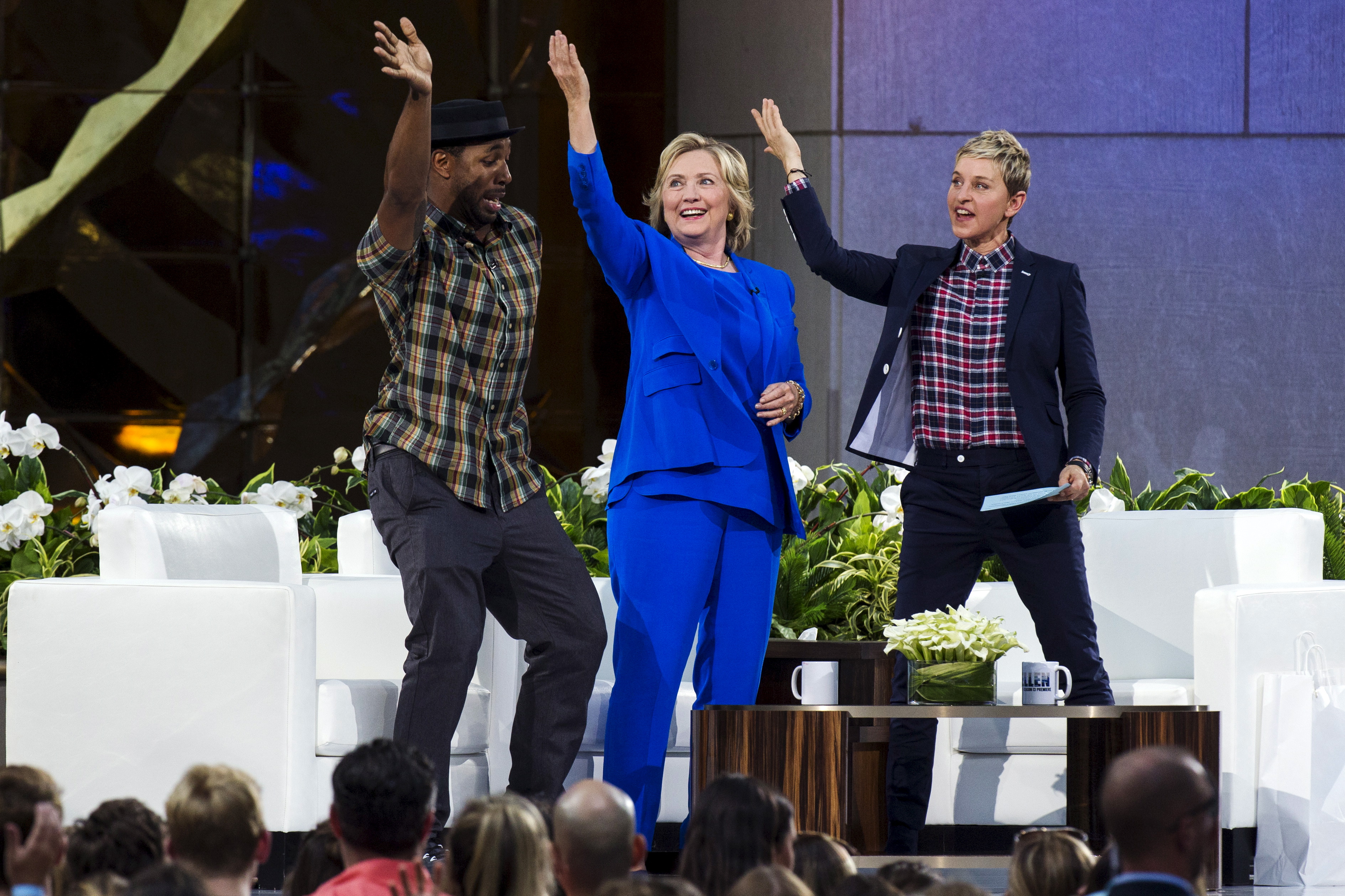 Hillary Clinton does the "Nae Nae" dance move with DJ "Twitch" and Ellen DeGeneres during a taping of "The Ellen DeGeneres show" in New York 