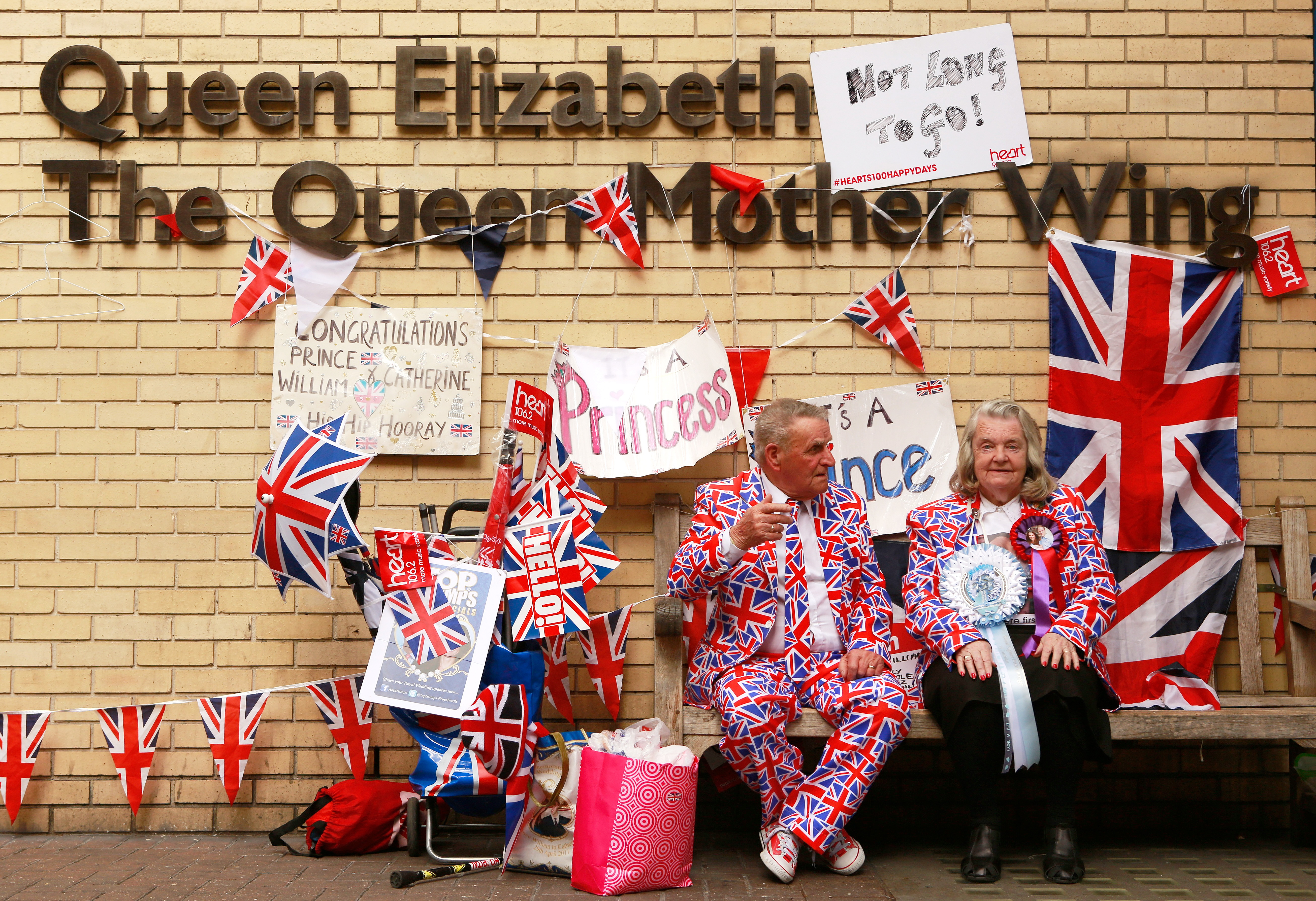 Royal enthusiasts sit outside the Lindo wing of St Mary's Hospital where Britain's Catherine, Duchess of Cambridge, is expected to give birth to her second child in the next few days, in central London, England