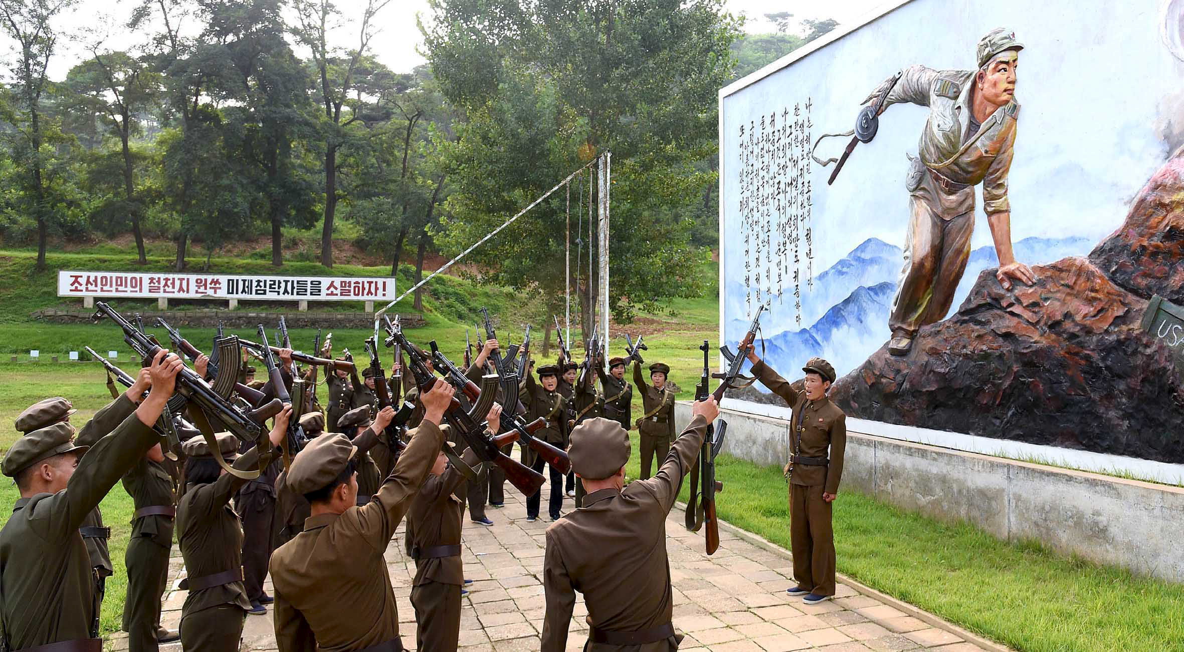 North Koreans sign up to join the army in the midst of political tension with South Korea, in this undated photo released by North Korea's Korean Central News Agency (KCNA) in Pyongyang