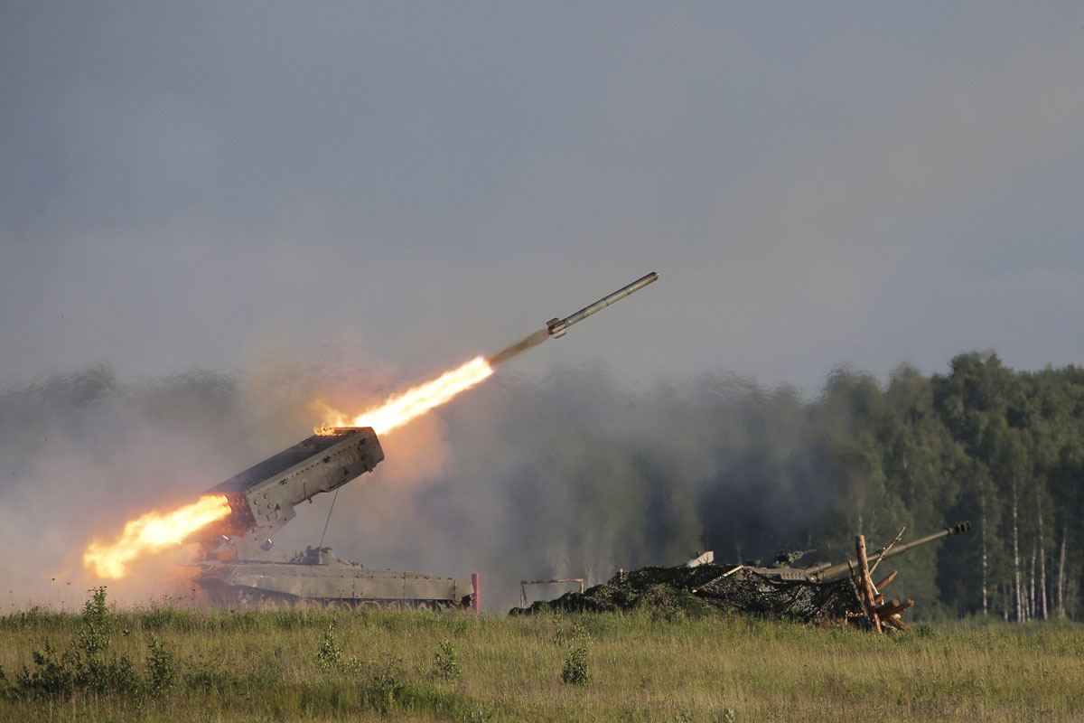 A Russian TOS-1A multiple rocket launcher fires during the opening of the Army-2015 international military forum in Kubinka