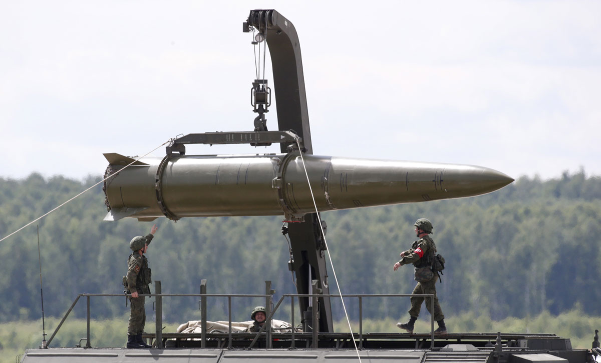 Russian servicemen equip an Iskander tactical missile system at the Army-2015 international military-technical forum in Kubinka