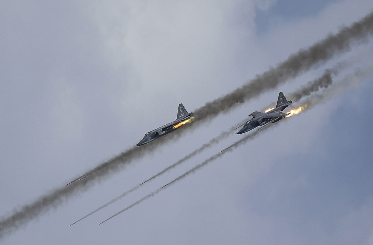 Russian Sukhoi Su-25 Frogfoot ground-attack planes perform during the Aviadarts military aviation competition at the Dubrovichi range near Ryazan, Russia