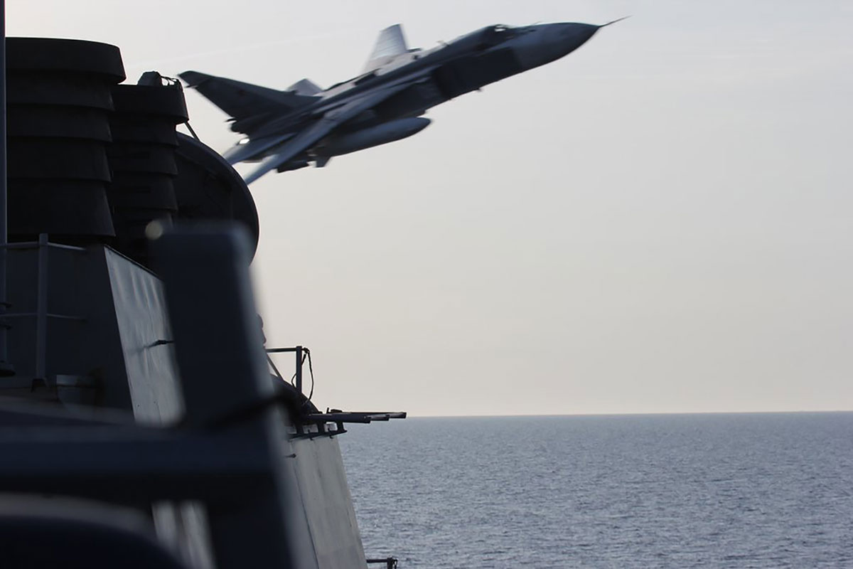 Russian Sukhoi SU-24 attack aircraft makes low pass close to the U.S. guided missile destroyer USS Donald Cook in the Baltic Sea