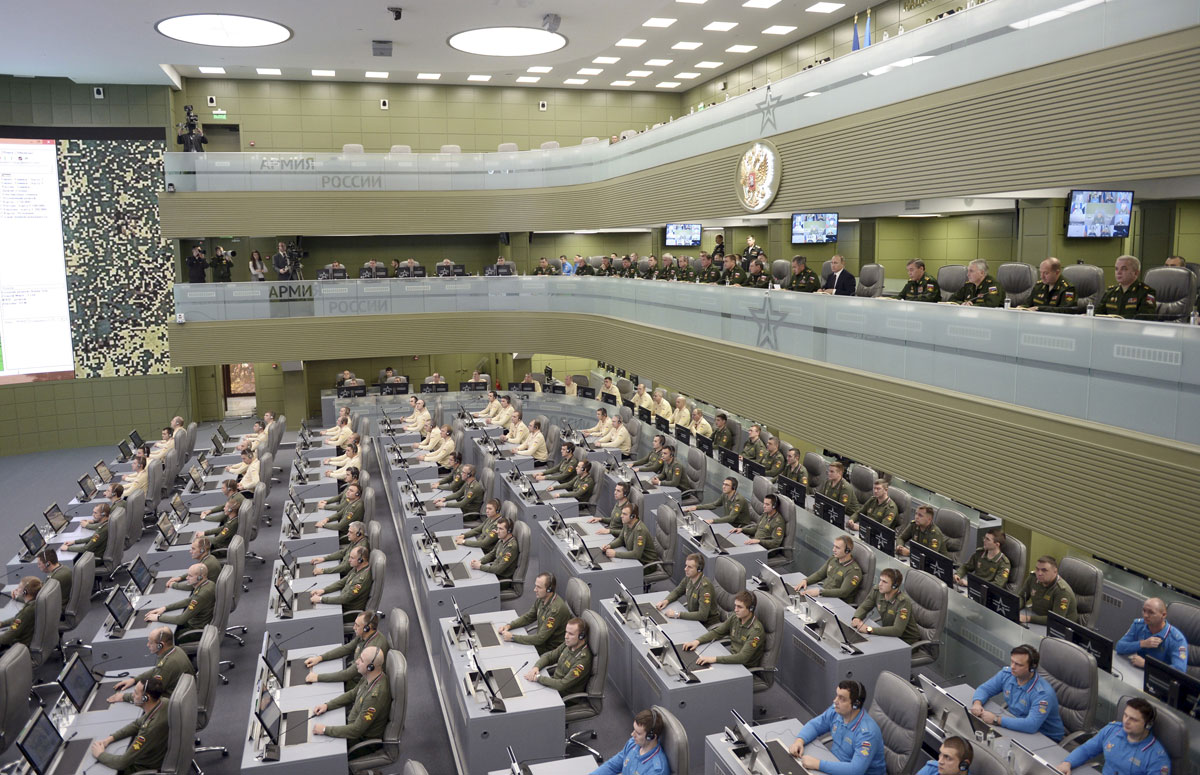 Russian President Putin with Defence Minister Shoigu and armed forces Chief of Staff Gerasimov attend meeting on Russian air force's activity in Syria at national defence control centre in Moscow