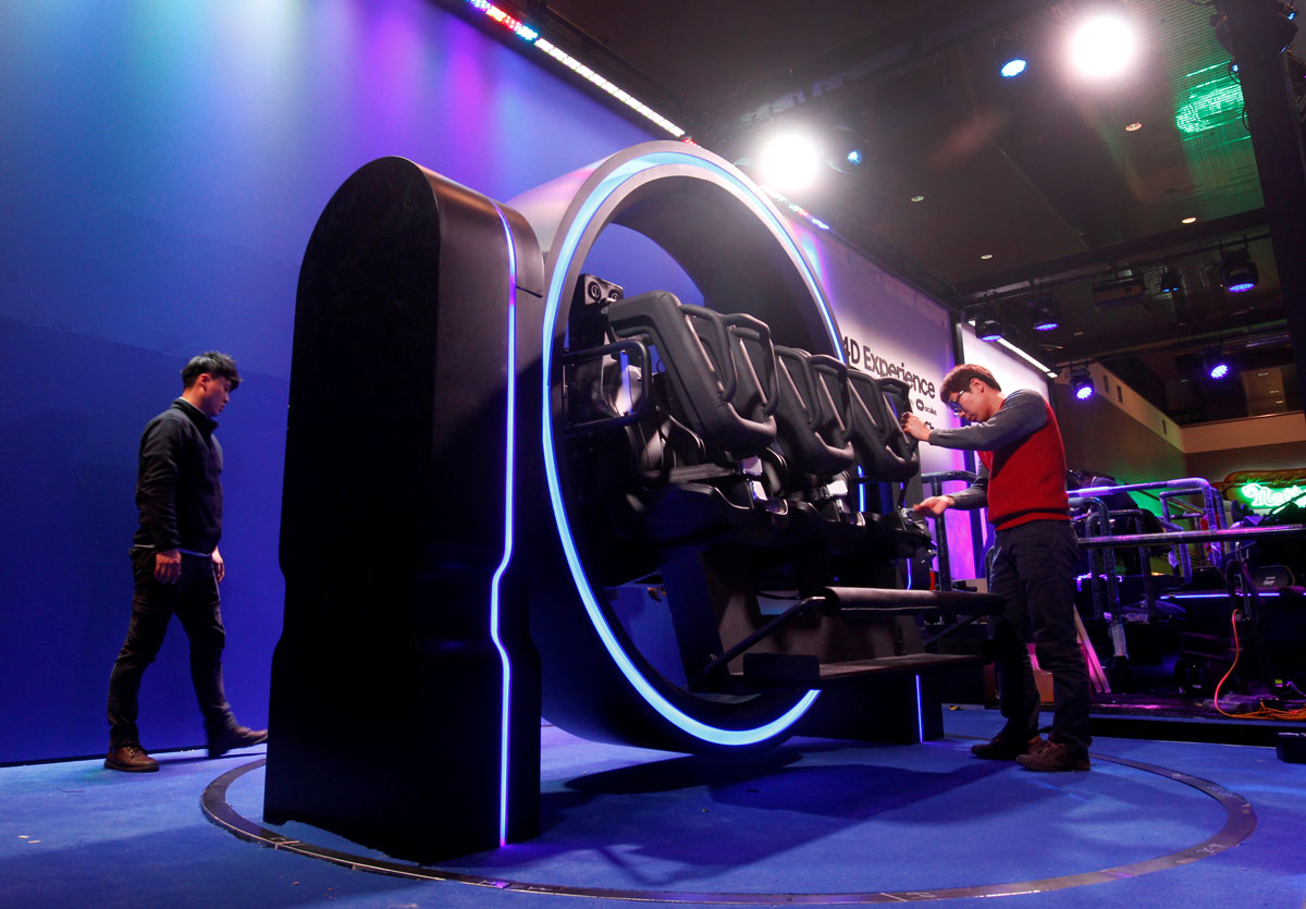 Samsung technicians prepare a display in the Las Vegas Convention Center lobby for the 2017 International CES technology trade show in Las Vegas