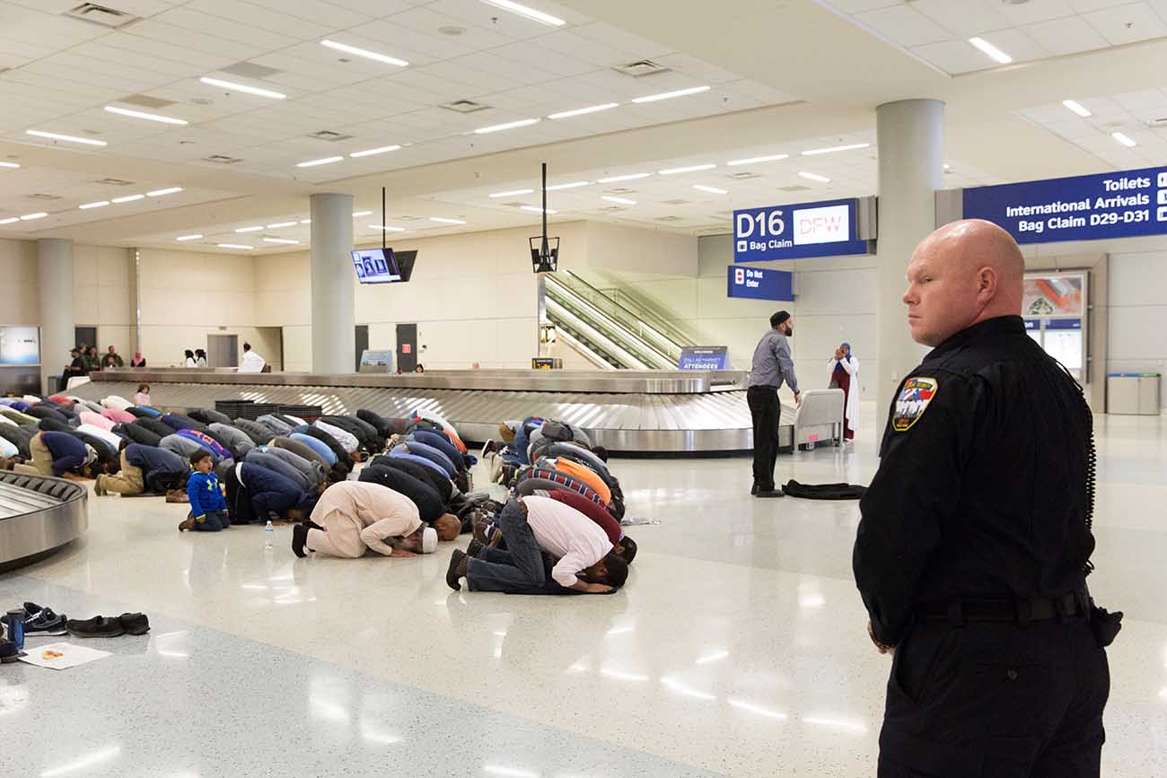 People gather to protest against the travel ban imposed by U.S. President Donald Trump's executive order, at Dallas/Fort Worth International Airport