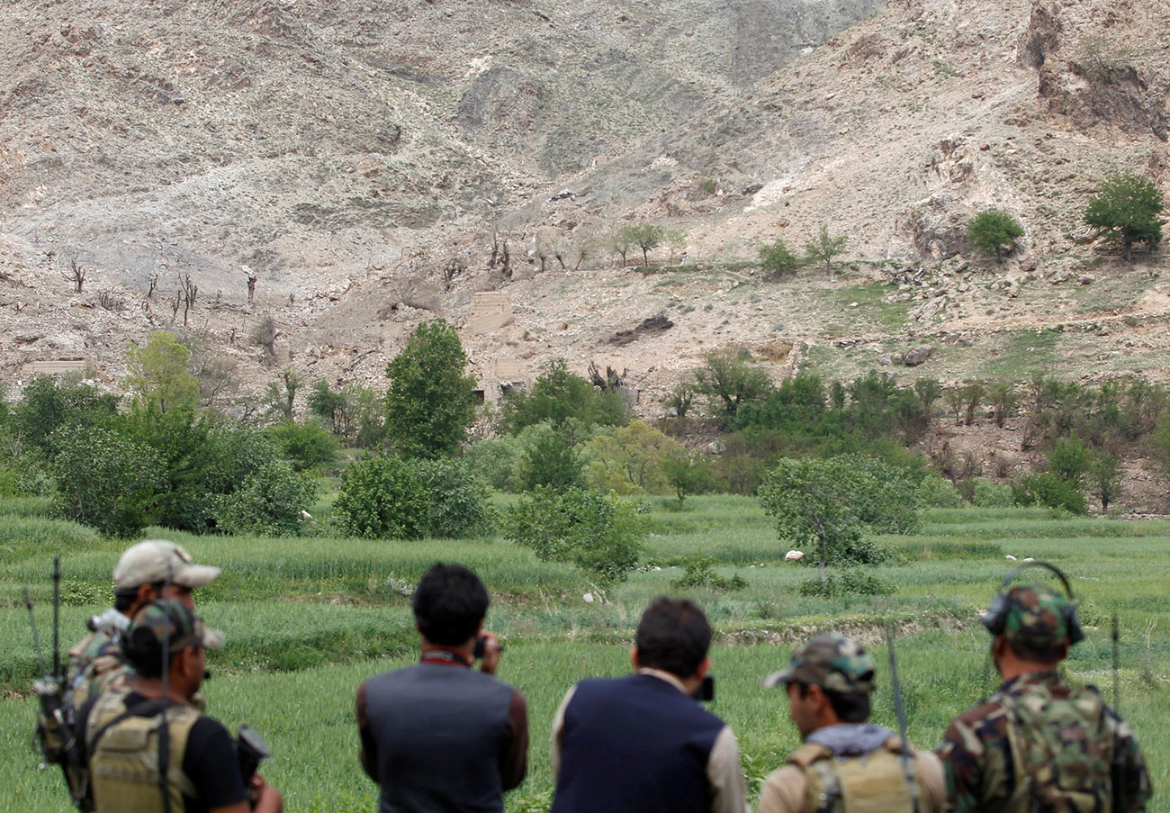Afghan Special Forces watch at the site where a MOAB, or ''mother of all bombs'', struck the Achin district of the eastern province of Nangarhar, Afghanistan