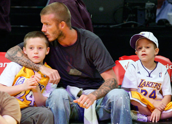 David Beckham with his sons at a Lakers game