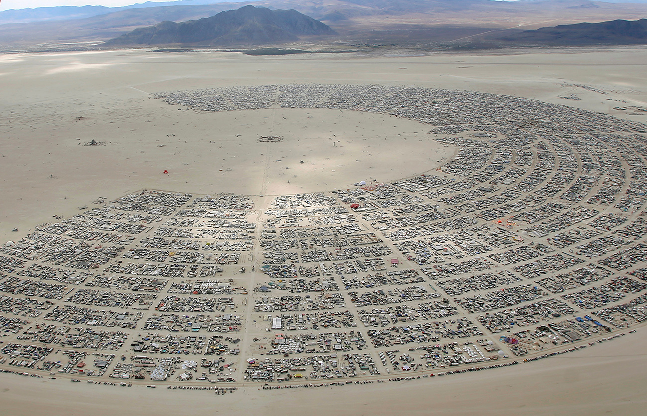 An aerial view as approximately 70,000 people from all over the world gather for the 30th annual Burning Man arts and music festival in the Black Rock Desert of Nevada, U.S.
