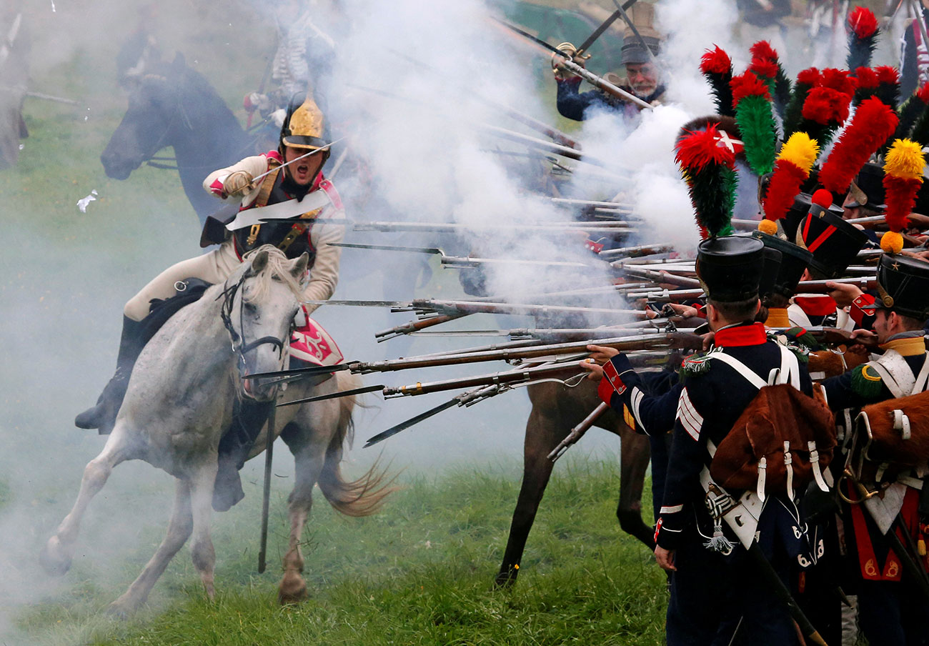 Participants reenact the 1812 Battle of Borodino between Russia and the invading French army during anniversary celebrations in Moscow region