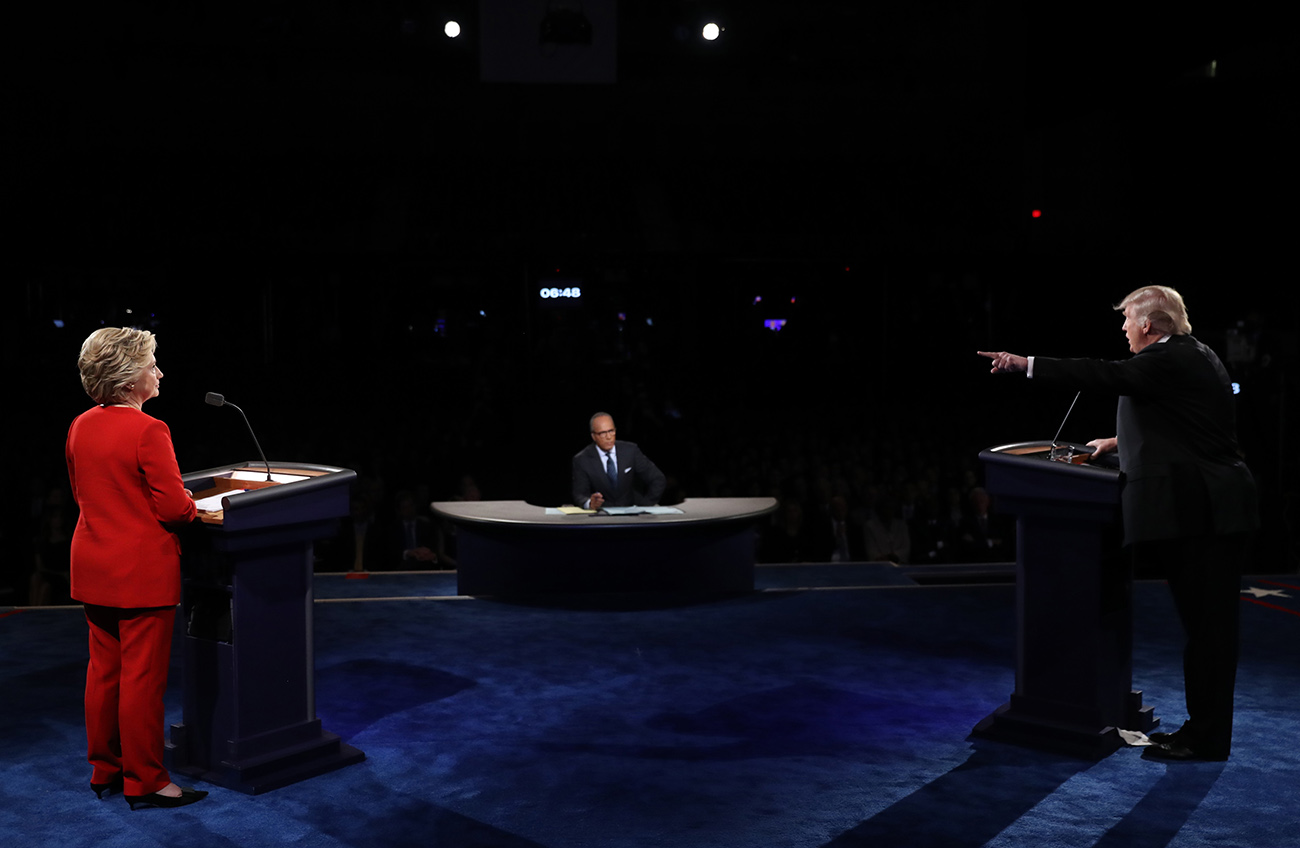 Republican U.S. presidential nominee Donald Trump speaks as Democratic U.S. presidential nominee Hillary Clinton listens during their first presidential debate at Hofstra University in Hempstead